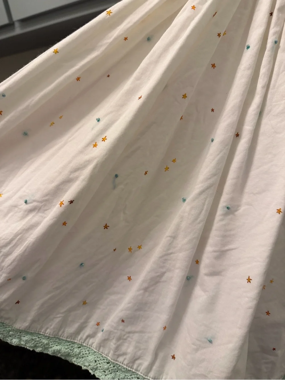 Well Dressed Wolf Cream Sundress with Yellow and Mint Accents